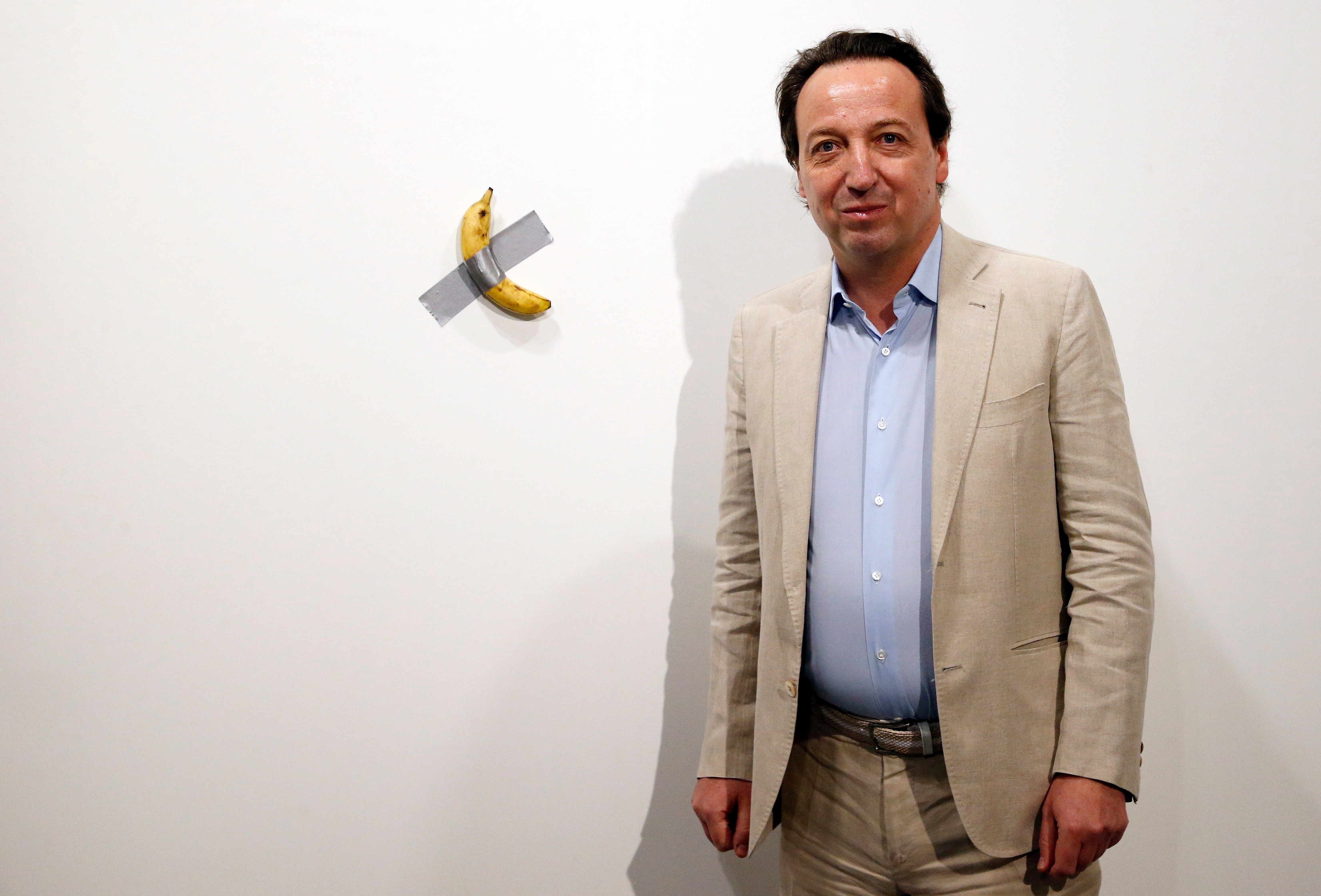 Man eats $120,000 piece of art - a banana taped to wall | SBS News