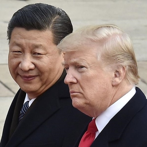 US President Donald Trump (R) and Chinese President Xi Jinping