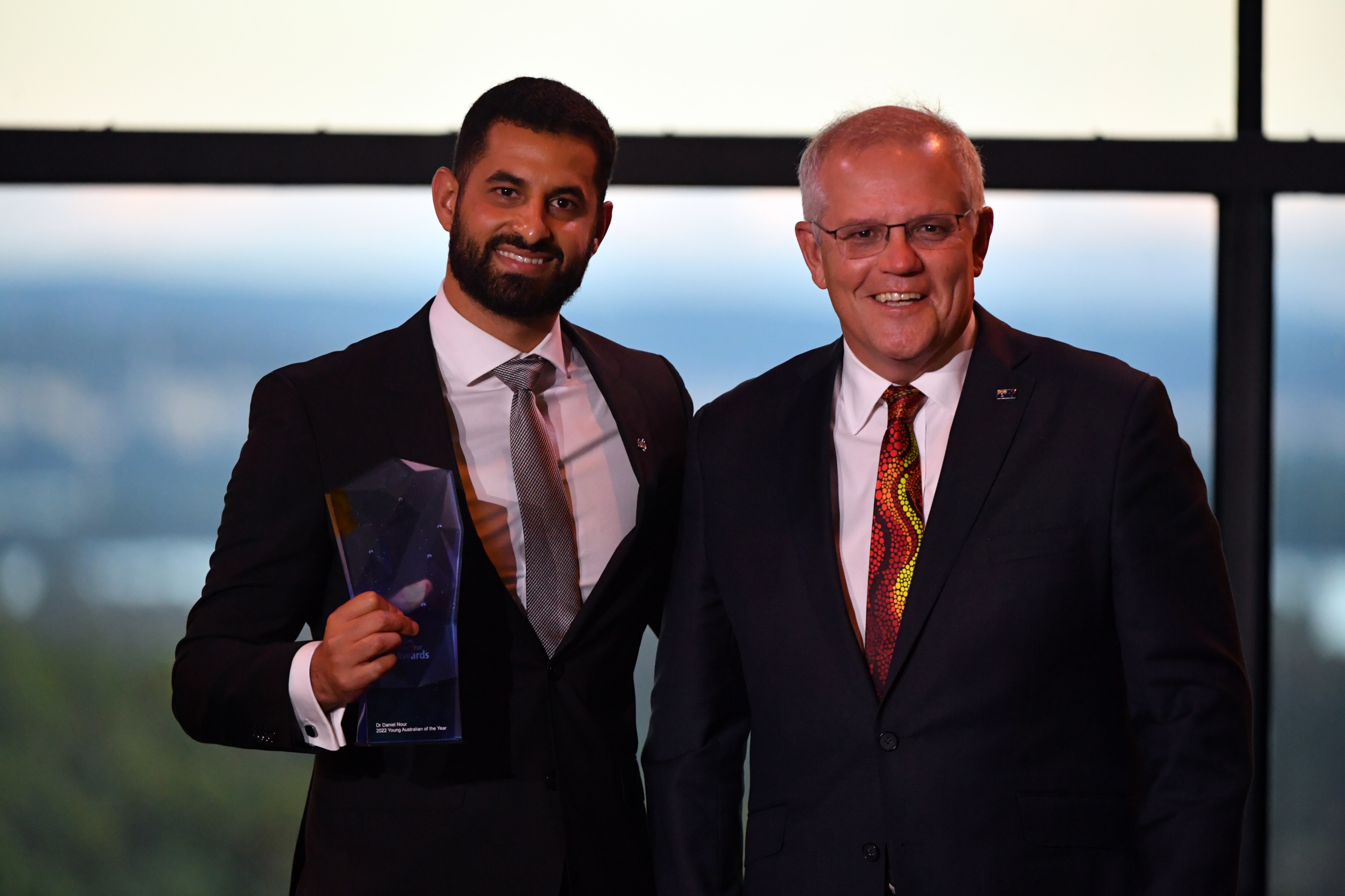 Prime Minister Scott Morrison (right) and the 2022 Young Australian of the Year winner Dr Daniel Nour.