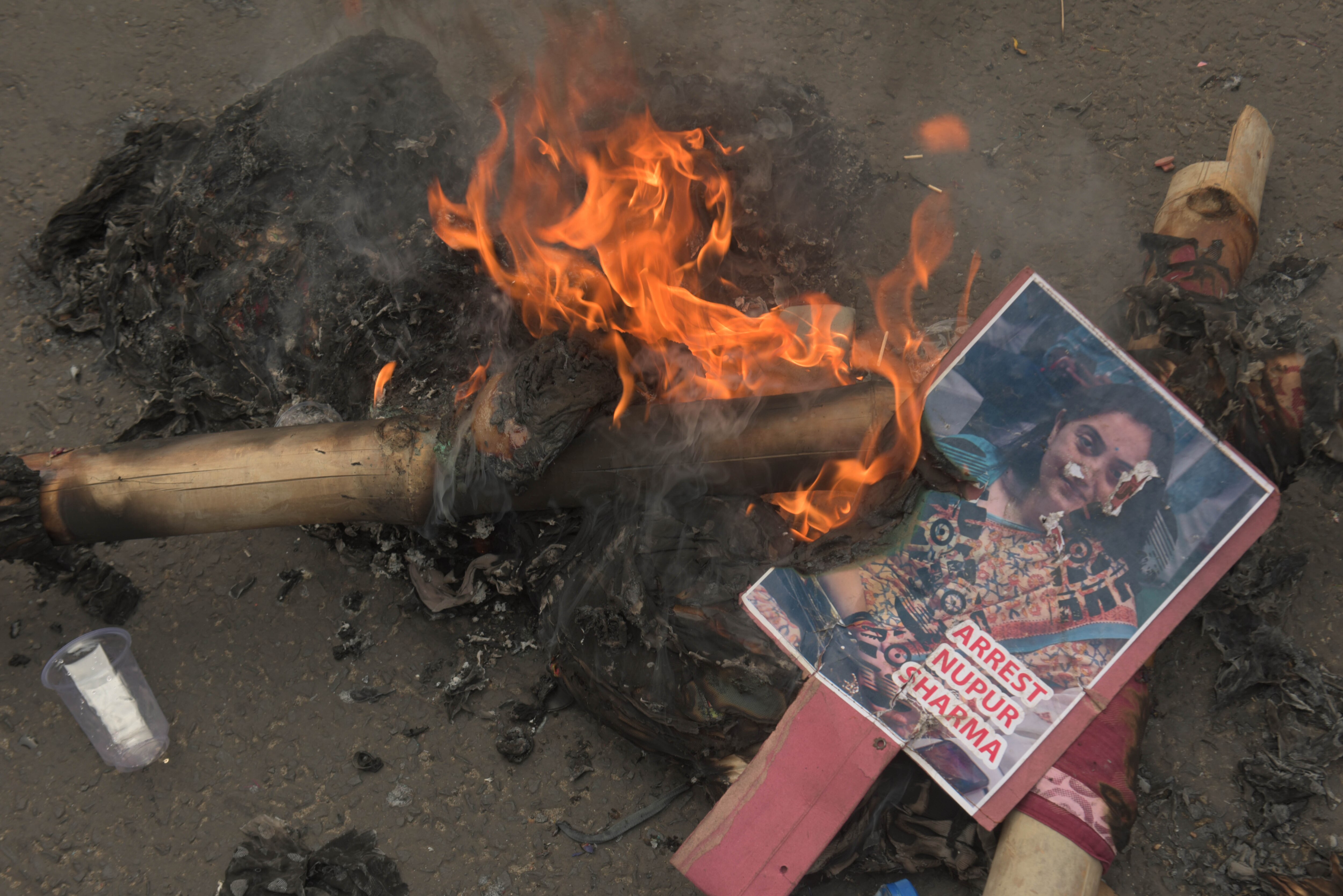 Members of the Muslims community burn an image of now suspended BJP spokesperson Nupur Sharma in Kolkata, India.