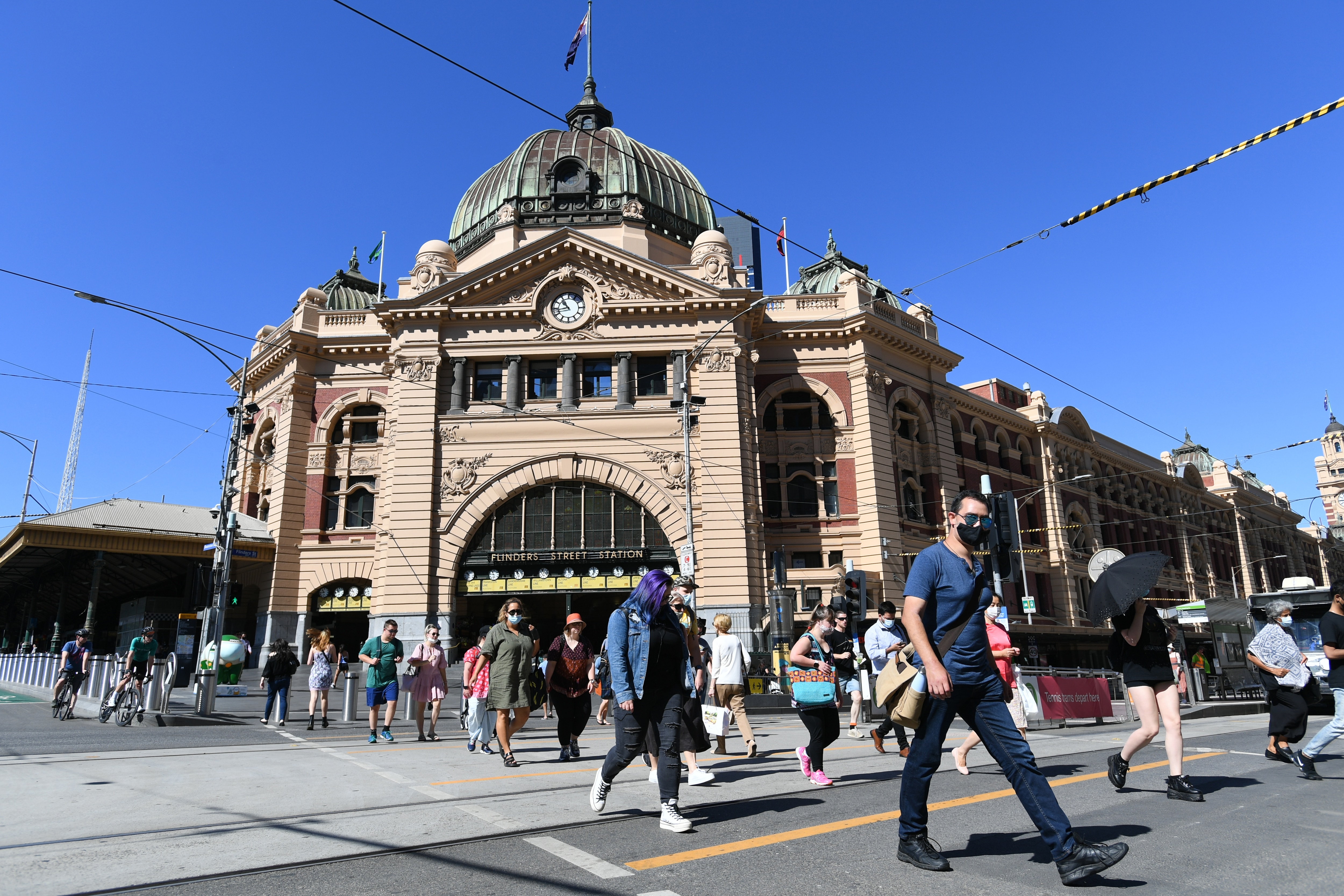 People outside Flinders Street station in Melbourne