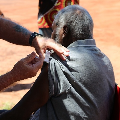 A man receives a coronavirus vaccine in the remote Aboriginal community of Beagle Bay, WA 