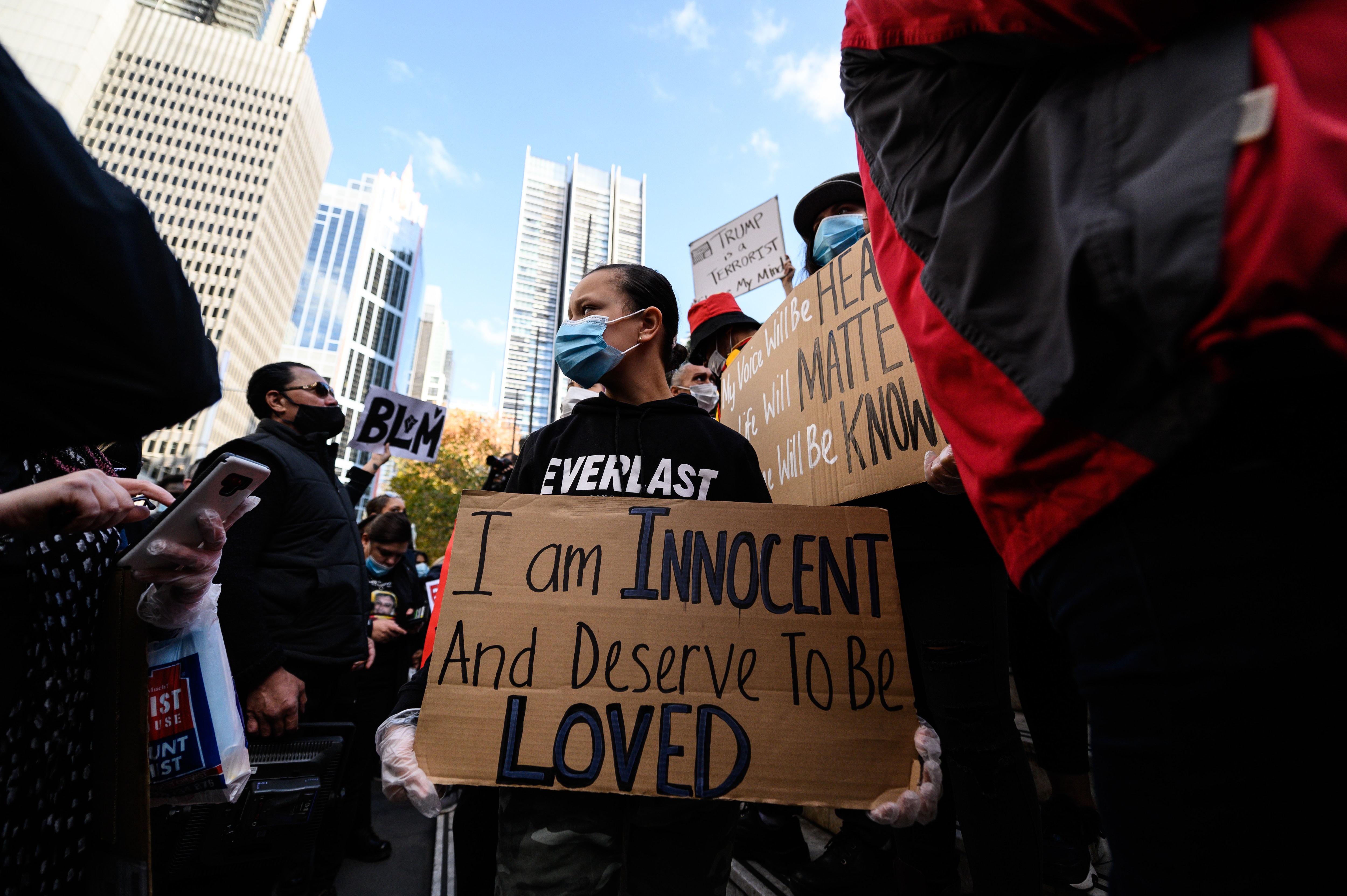 Protesters carried signs with a powerful message for authorities and fellow Australians. Protester stands for a racial equality at Sydney rally.