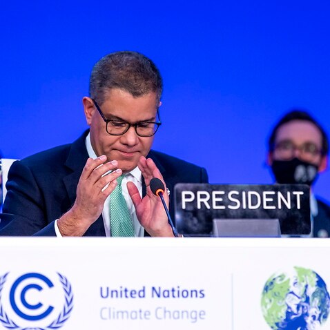 Alok Sharma (L), President of COP26 speaks during the final session of the COP26 UN Climate Change Conference in Glasgow,13 November 2021.