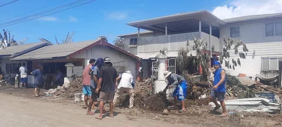 Clean up efforts on the ash-covered streets of Tonga's capital Nuku'alofa after an underwater volcanic eruption triggered a tsunami.