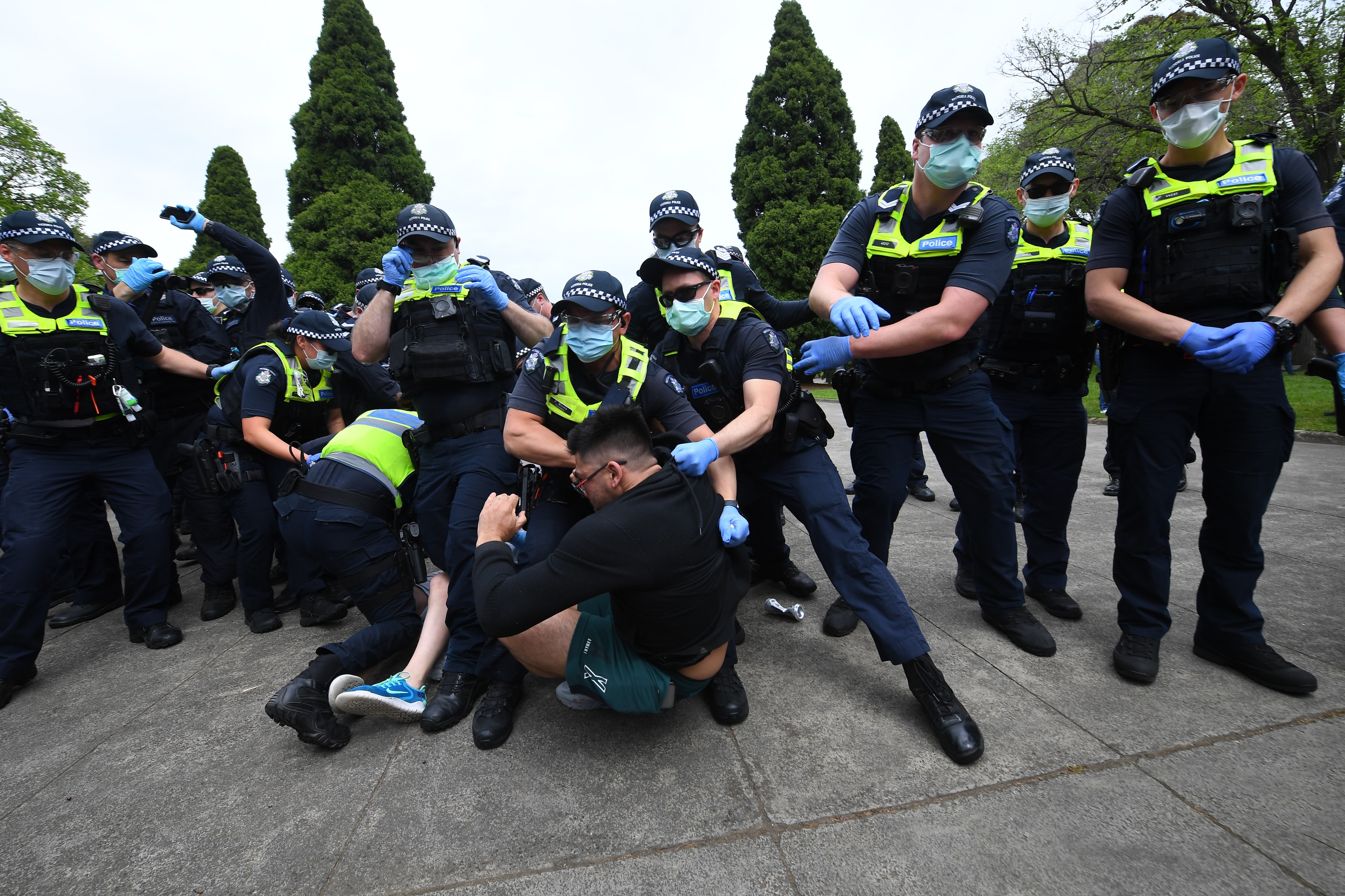 Protesters are seen during an anti-lockdown protest in Melbourne on 23 October.