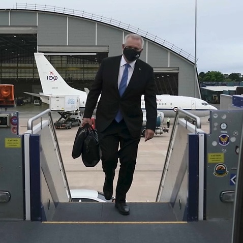Scott Morrison boards the plane, bound for Europe