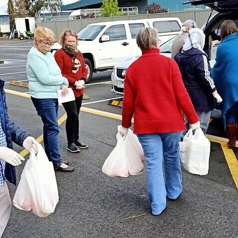  A Sikh volunteer helping community members to deliver free food in Shepparton, Victoria.  
