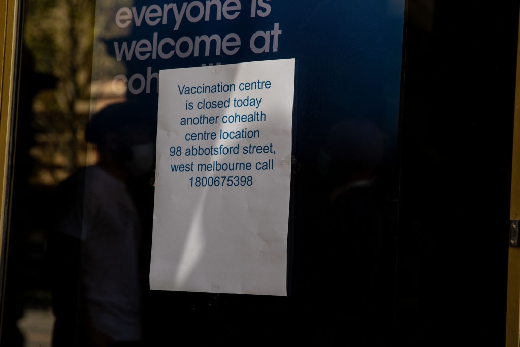 A sign is seen advising visitors the temporary closure of the Cohealth Melbourne Town Hall vaccination centre on 23 September, 2021. 