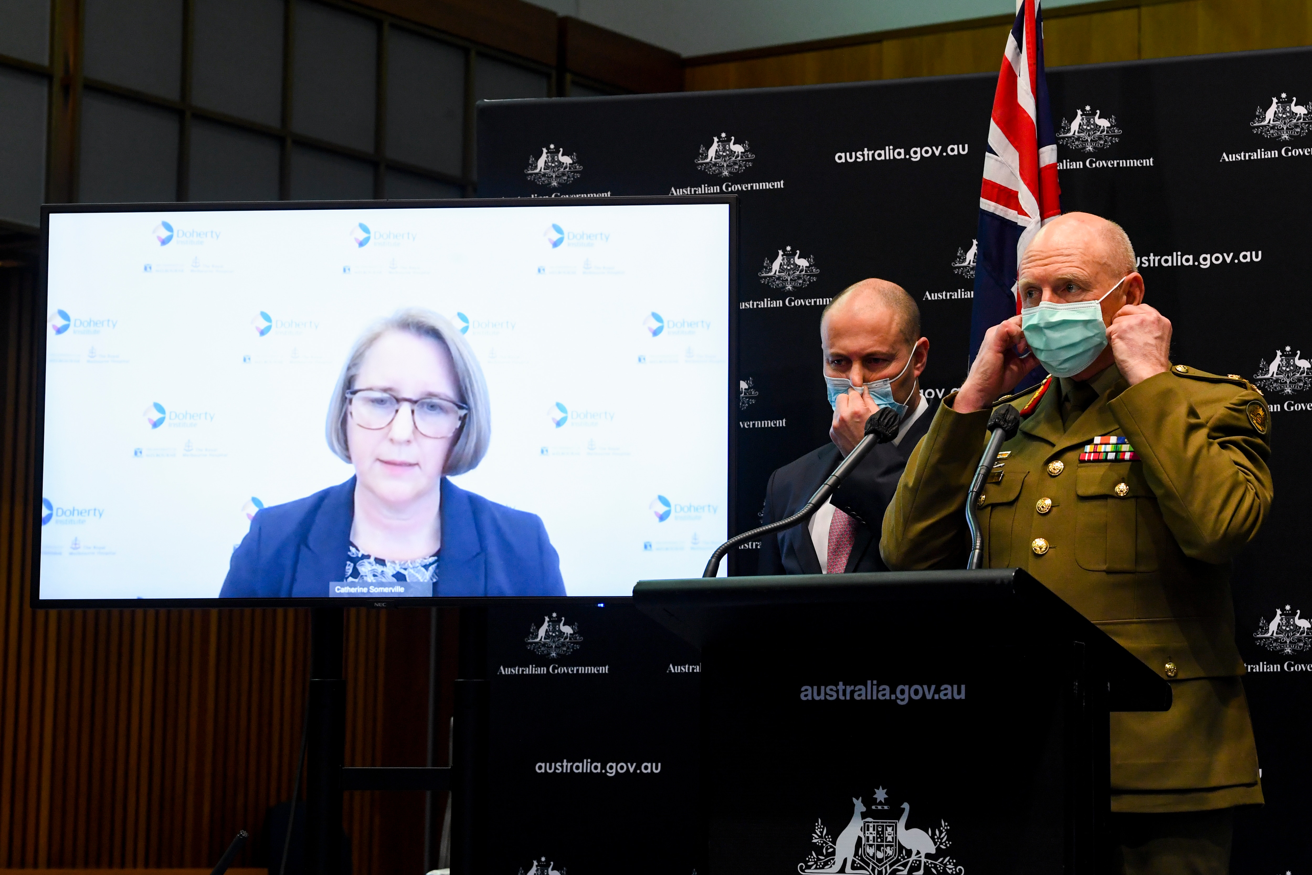 Professor Jodie McVernon of the Doherty Institute speaks virtually to the media during a press conference at Parliament House in Canberra,