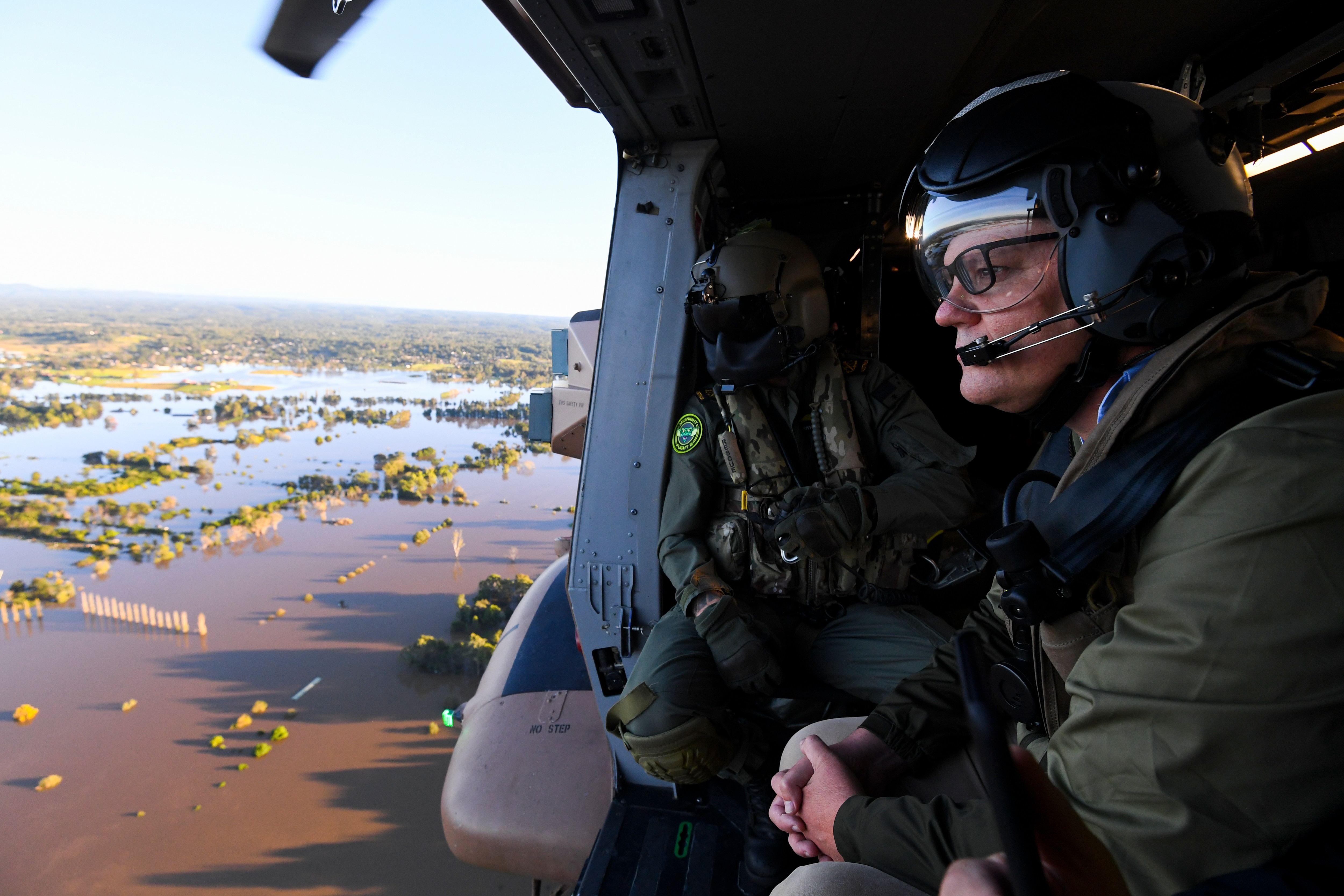 Prime Minister Scott Morrison inspects damage created by floodwaters from a helicopter in Sydney on Wednesday.