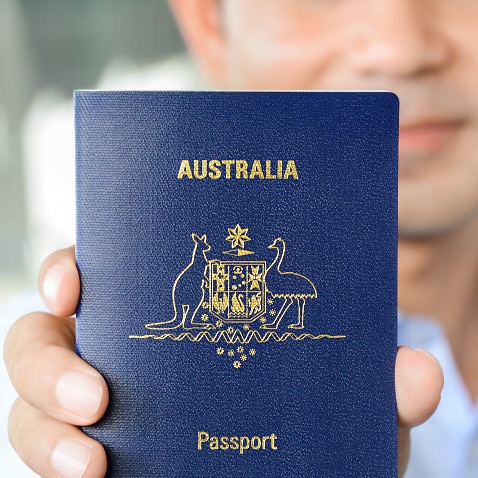 A man showing passport (of Australia)