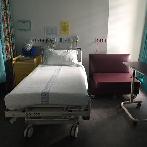 An empty hospital bed 