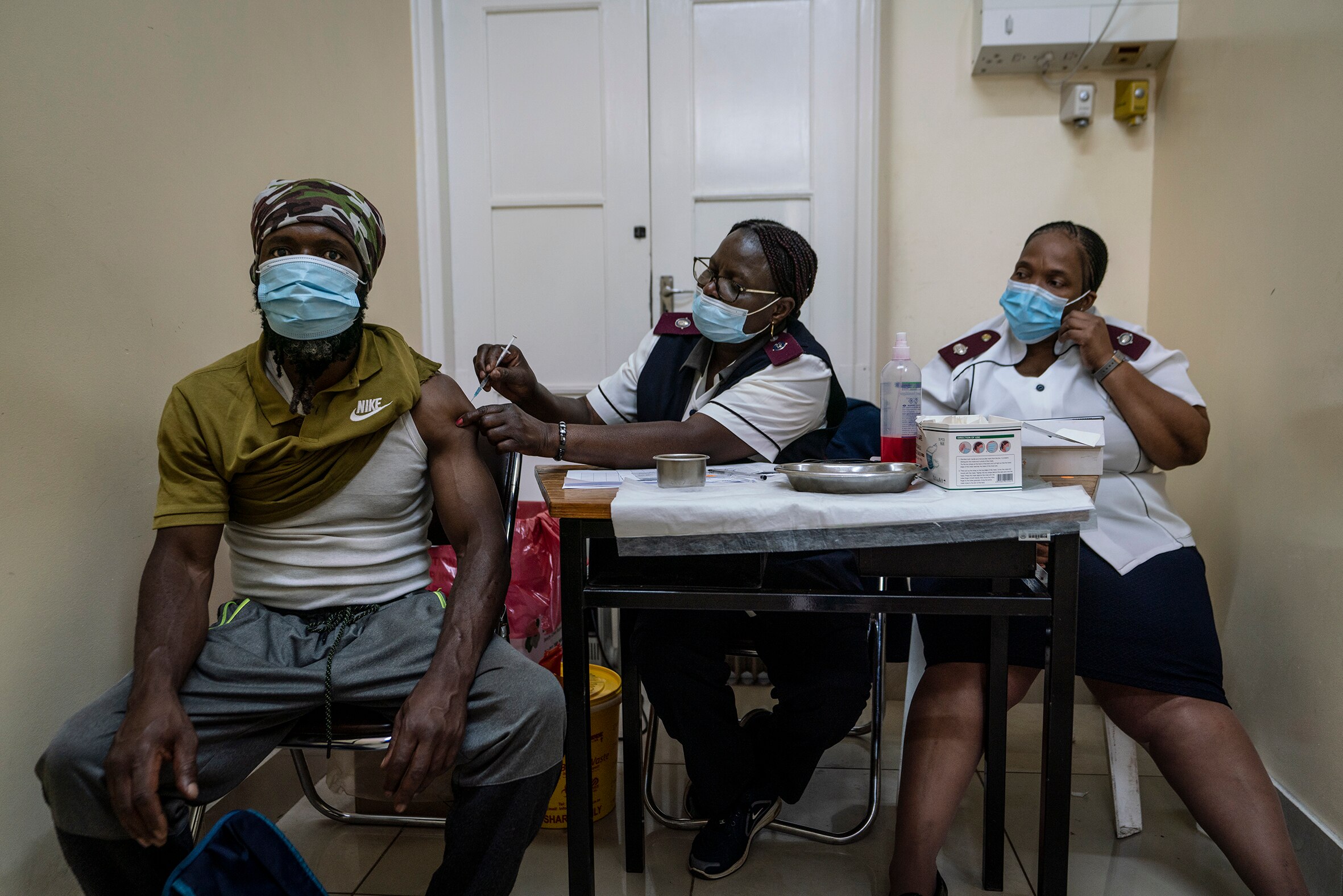 A man is vaccinated against COVID-19 at the Hillbrow Clinic in Johannesburg, South Africa, Monday, 6 December, 2021. 