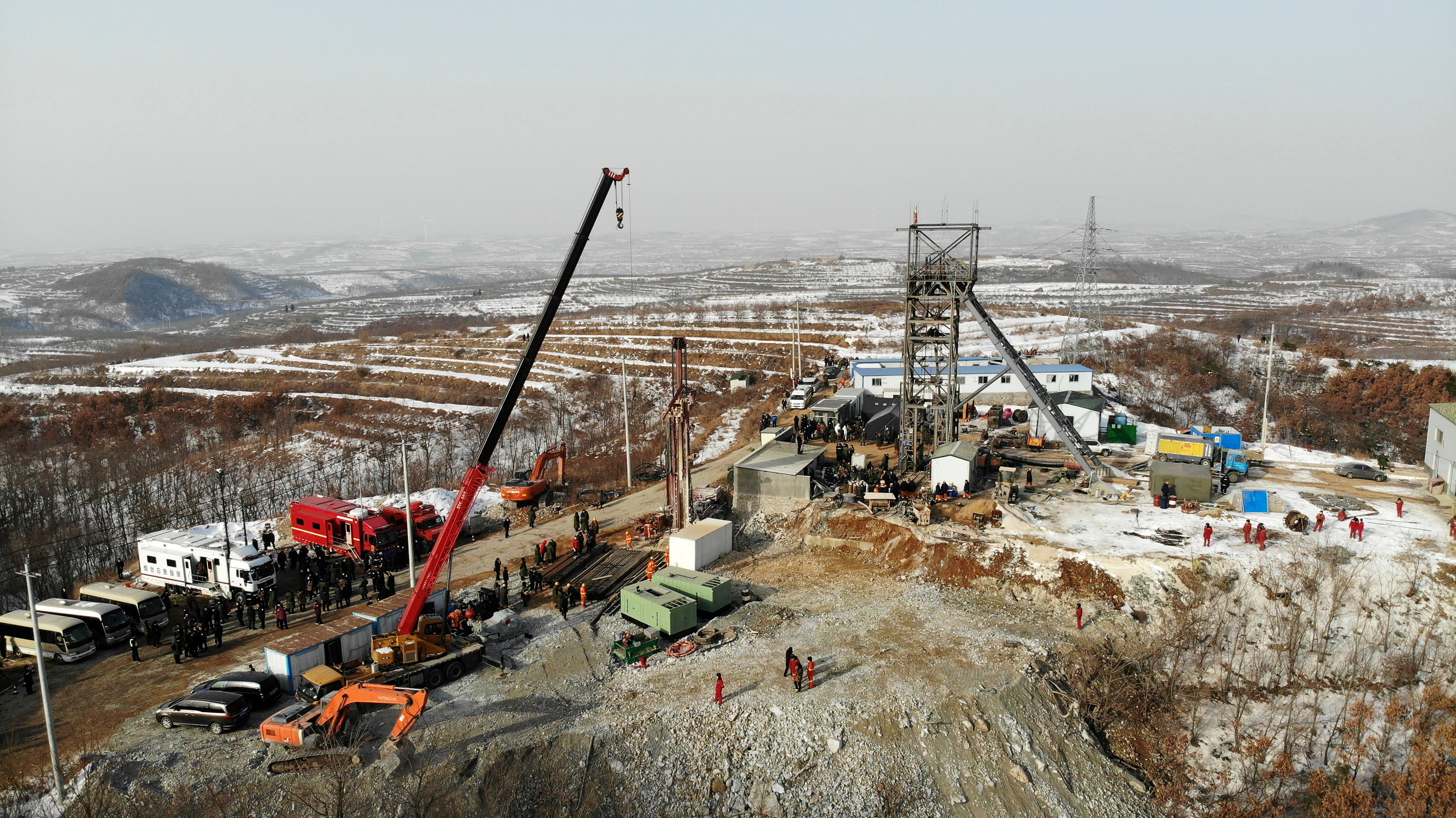 In this photo released by China's Xinhua News Agency, rescuers work at the site of the gold mine that suffered an explosion in Qixia on Wednesday, 13 January.