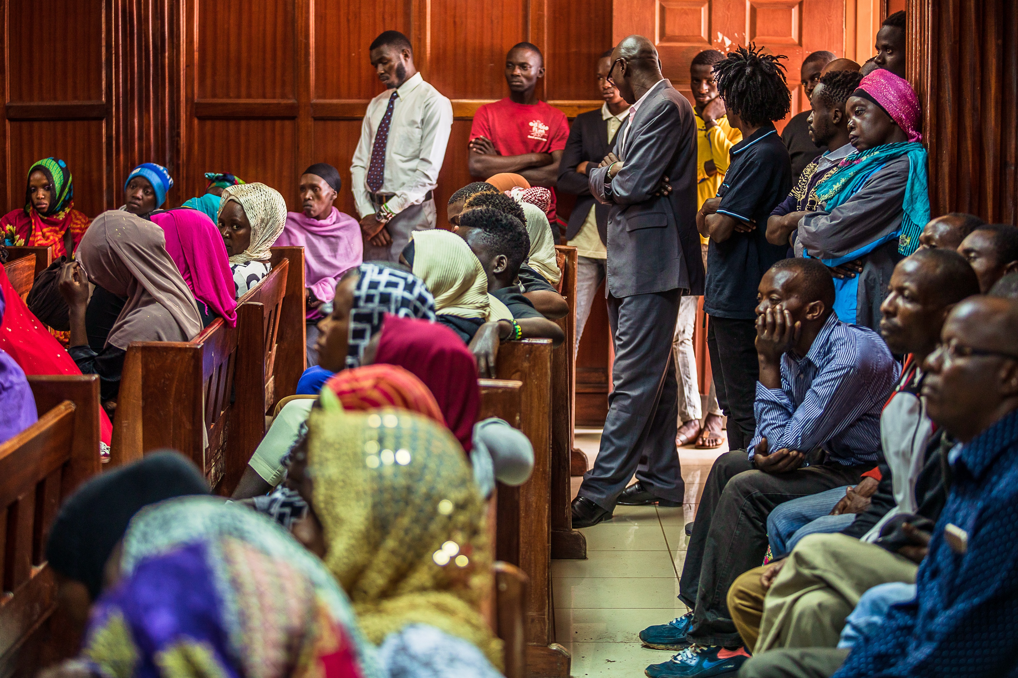 People gather inside a courtroom in Nairobi, Kenya for a hearing into a new biometric national identification system on Dec. 18, 2019. People gather inside a courtroom in Nairobi, Kenya.