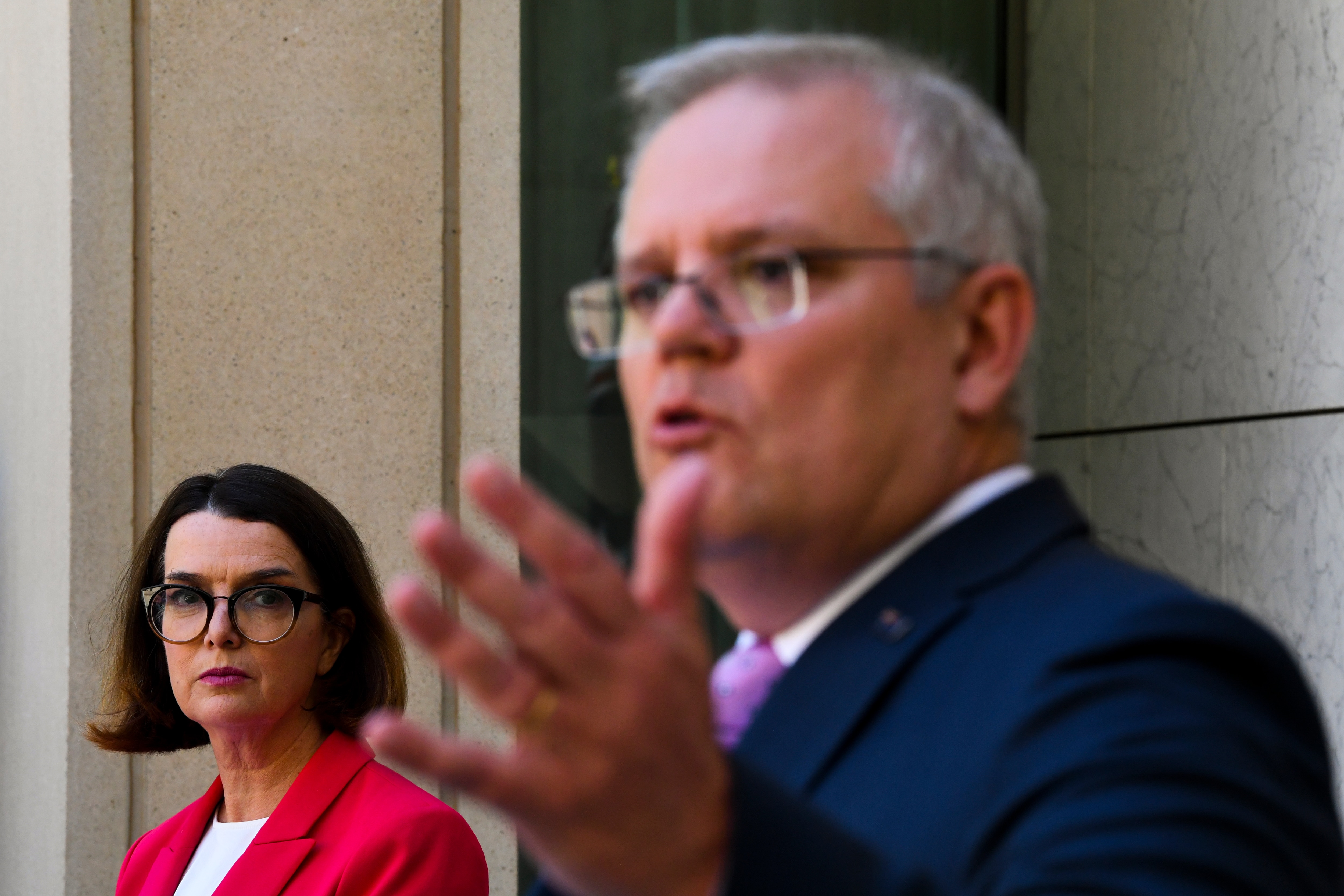 Social Services Minister Anne Ruston (left) listens to Prime Minister Scott Morrison.