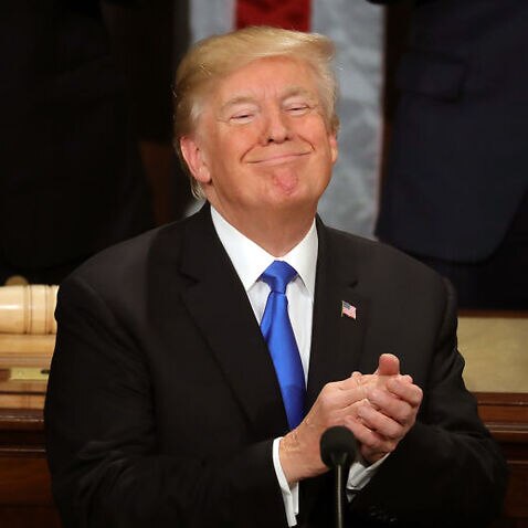 Donald Trump claps during a State of a Union residence in a cover of a US House of Representatives on 30 January, 2018.
