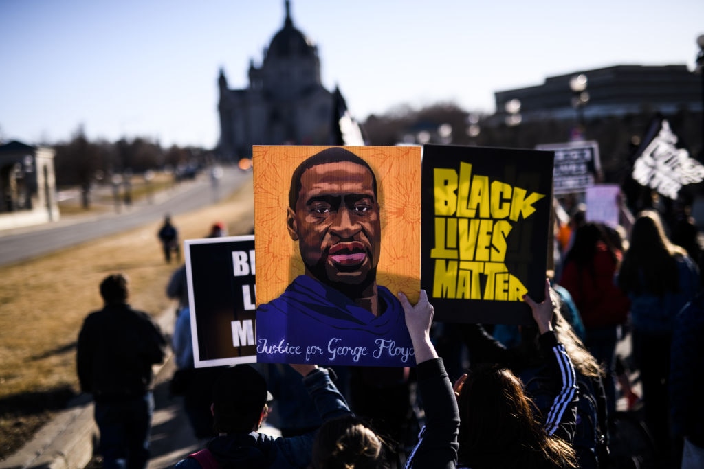 People march near the Minnesota State Capitol to honor George Floyd on 19 March 19, 2021 in St Paul, Minnesota. 