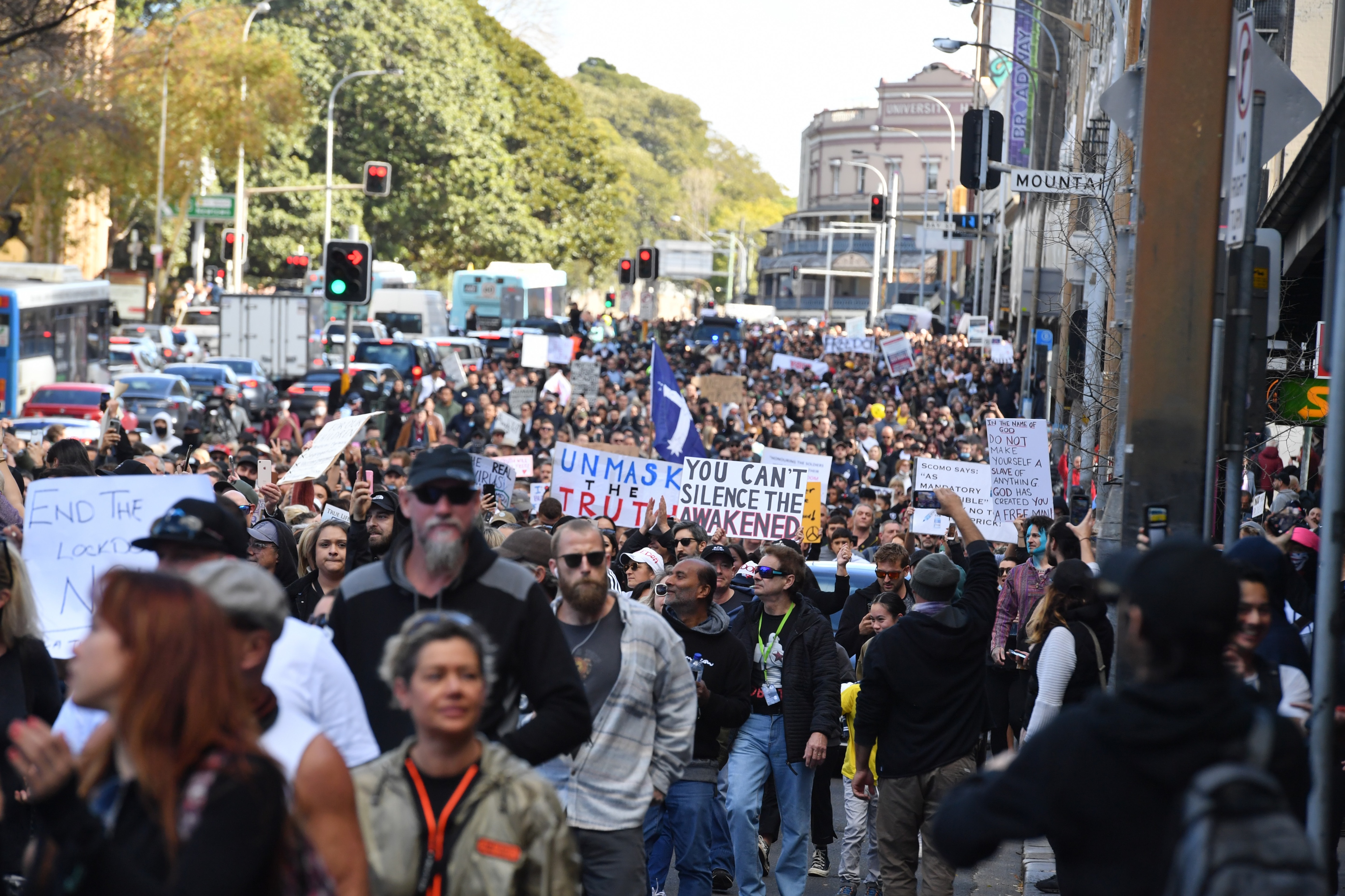 Protesters march along Broadway and George St towards Sydney Town Hall during the World Wide Rally For Freedom anti-lockdown rally.