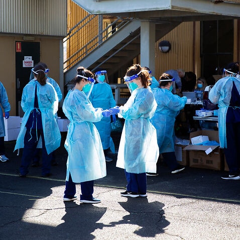 Health care workers are seen at a pop-up COVID-19 testing clinic in Rushcutters Bay on July 29, 2020 in Sydney, Australia.