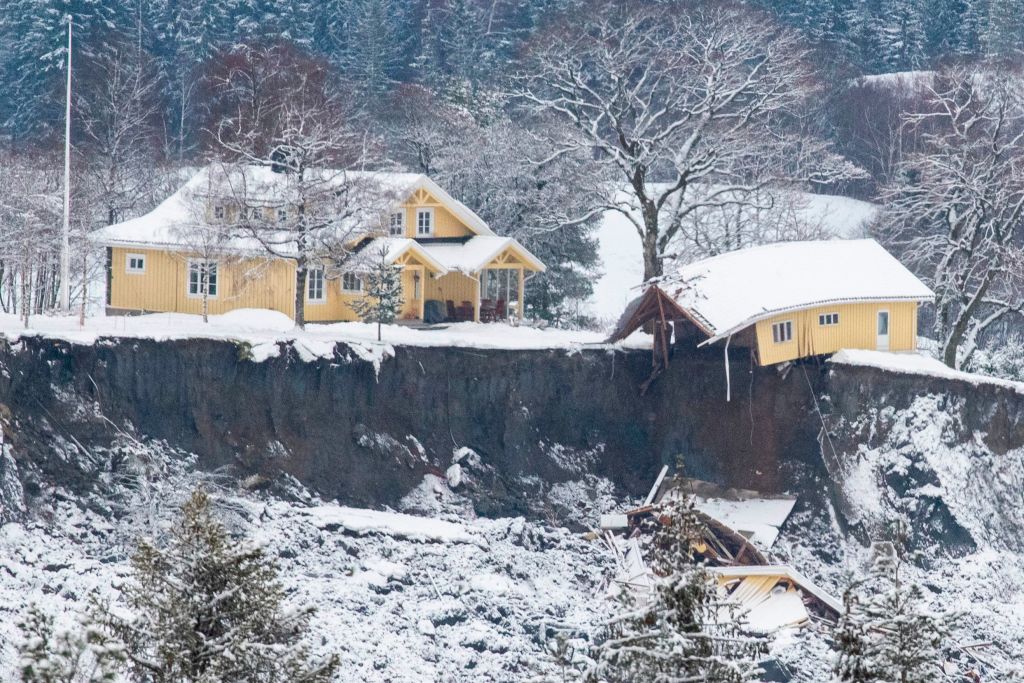 Several houses were swept away in Gjerdrum, home to 5,000 people 25 kilometres northeast of the capital, in the early hours of 30 December. A damaged house is seen at a landslide area in Ask, Norway.