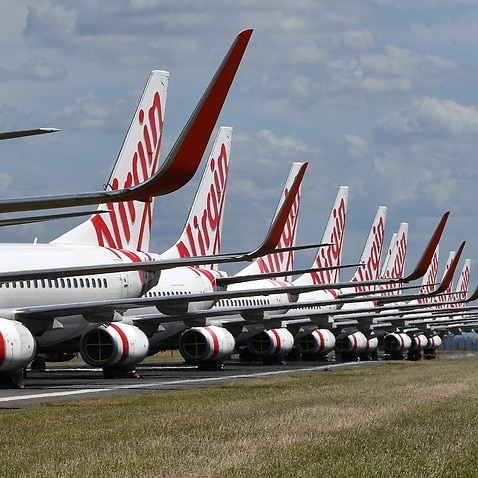 Grounded Virgin Australia aircraft are seen parked at Brisbane Airport 