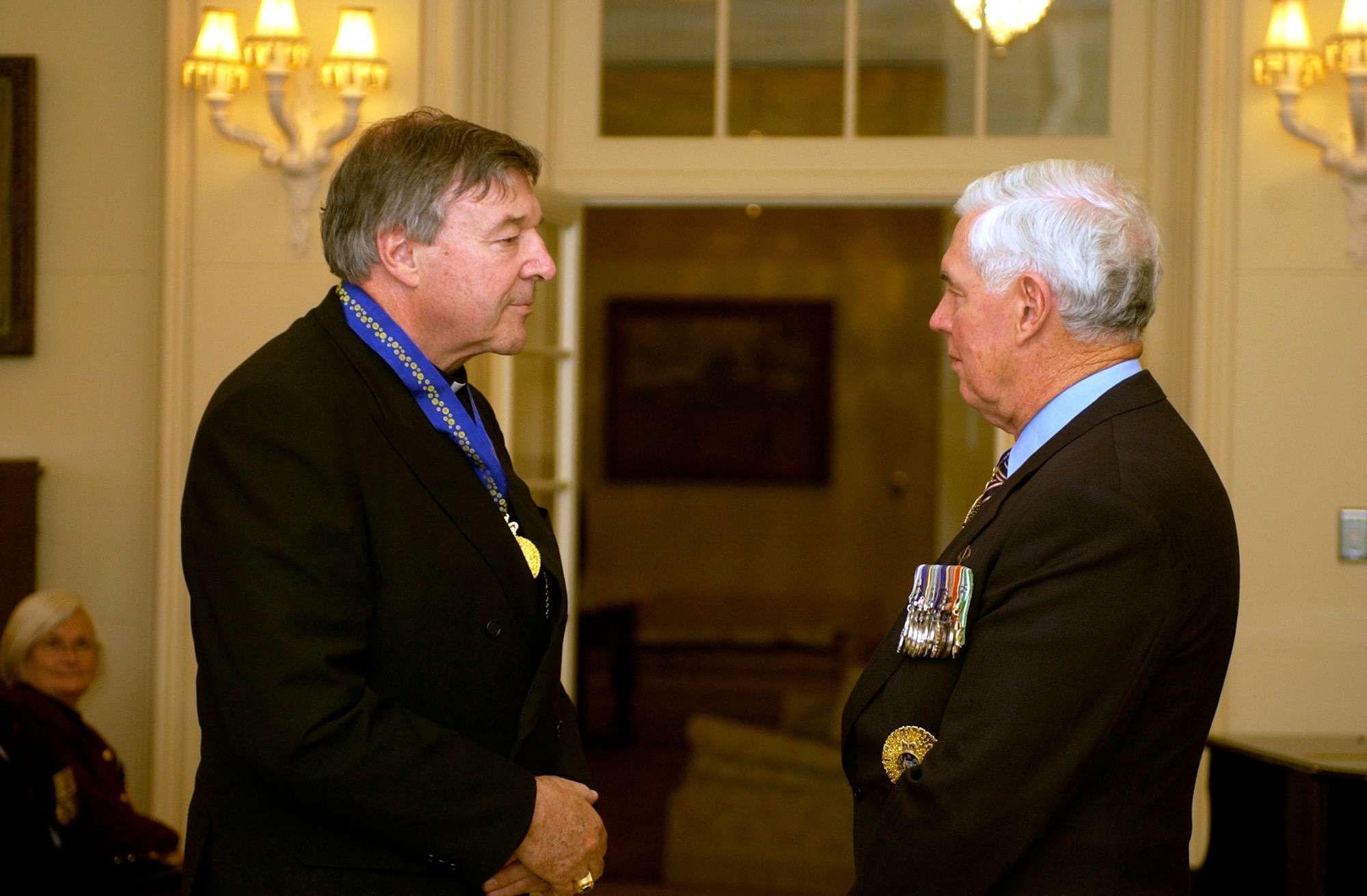 Cardinal George Pell receives the Order of Australia from Governor General Michael Jeffery in Canberra, September 2, 2005 (AAP)