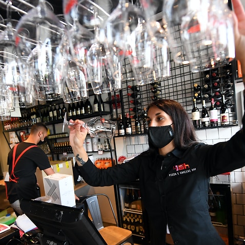 Staff at 48h Pizza and Gnocchi Bar in Elsternwick, Melbourne, prepare for Victoria's reopening on Thursday, October 2