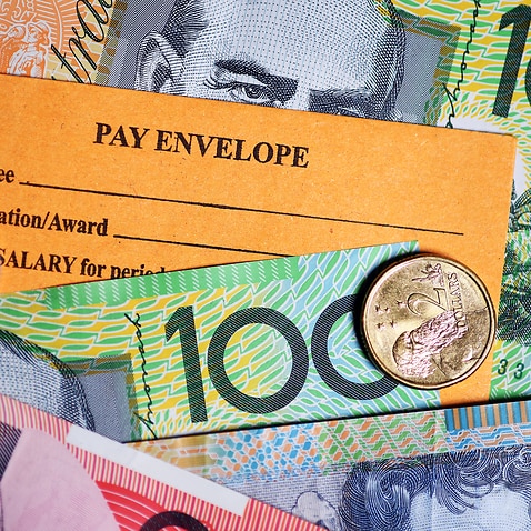 A stock photograph of Australian currency and a wages envelope 