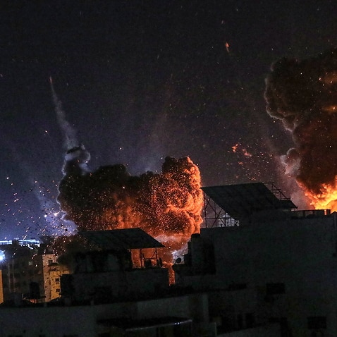 Smoke and flames rise following an Israeli air strike on Gaza City