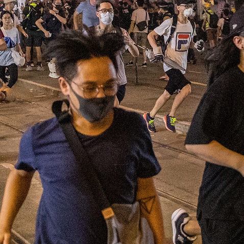Pro-democracy protesters run from the police during clashes after a march on September 29, 2019 in Hong Kong.