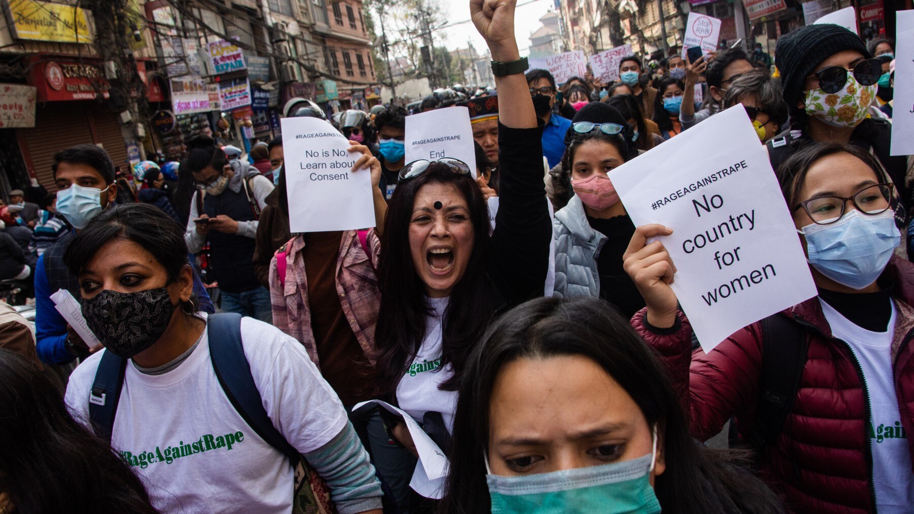 Nepalese Citizen Society activists hold placard and shout in the rally against woman violence and rising rape cases in Kathmandu, Nepal 