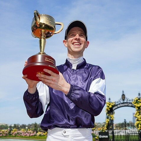 Jye McNeil with the trophy after winning the Lexus Melbourne Cup at Flemington Racecourse on November 03, 2020 in Flemington, Australia. (Scott Barbour/Racing Photos) 