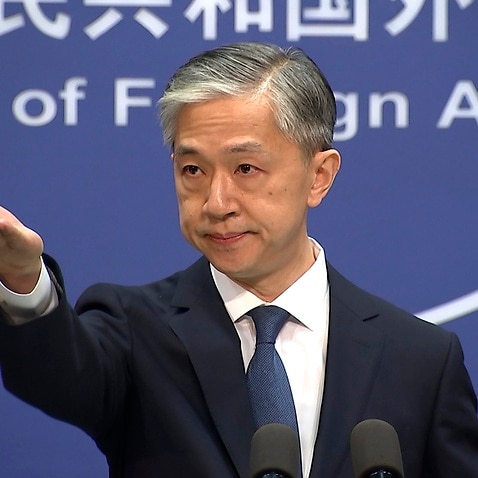 Foreign ministry spokesperson Wang Wenbin gestures during the daily briefing held at the Foreign Ministry in Beijing.