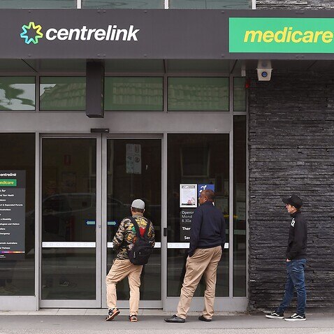 People outside a Centrelink office : WILLIAM WEST/AFP via Getty Images