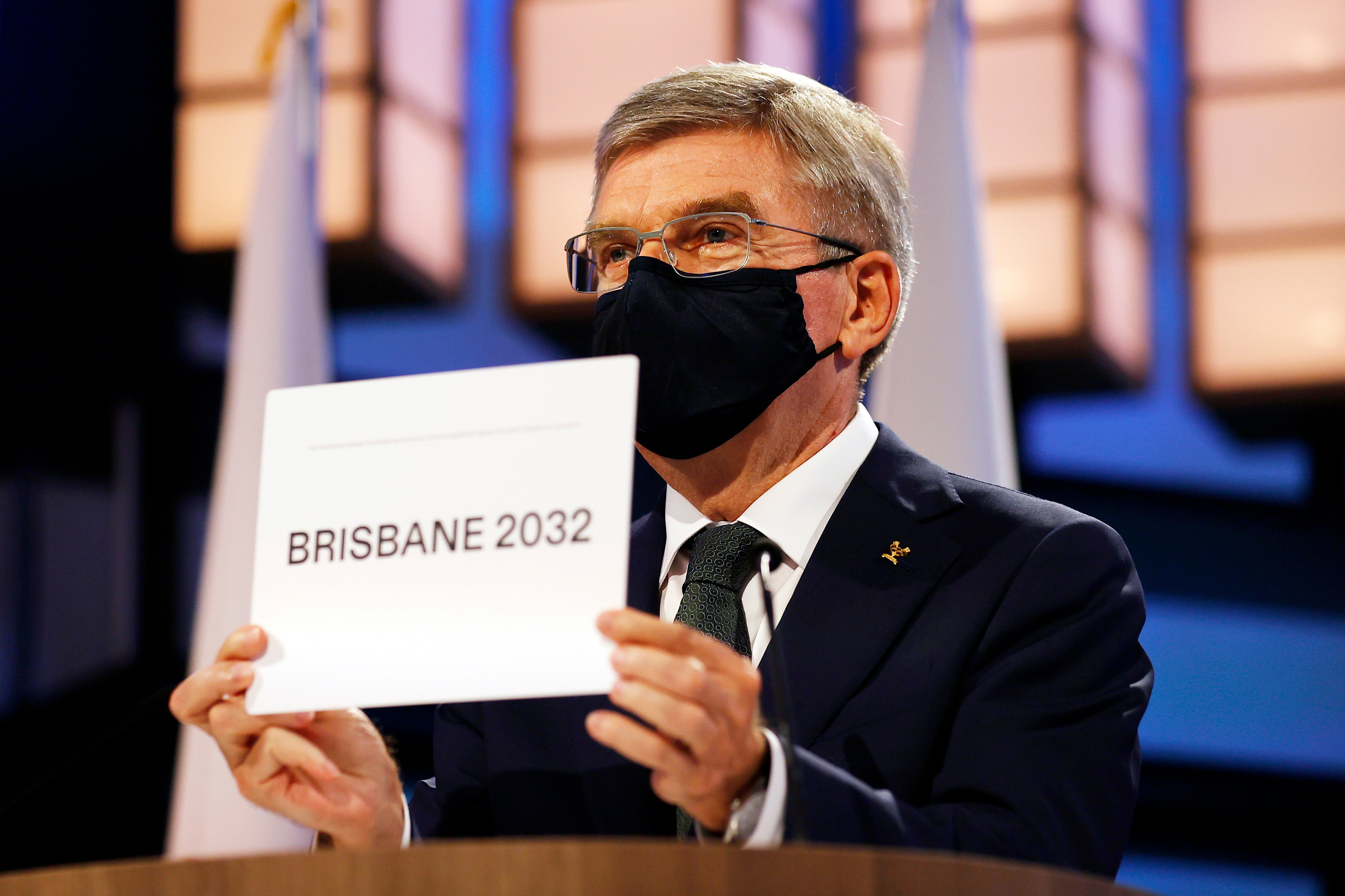 President of the International Olympic Committee Thomas Bach announces Brisbane as the 2032 Summer Olympics host city during the 138th IOC Session at Hotel Okura in Tokyo, Wednesday, July 21, 2021. (Toru Hanai/Pool Photo via AP)