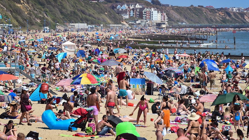 Tourists enjoy the hot weather at Bournemouth beach on 25 May 25, 2020.