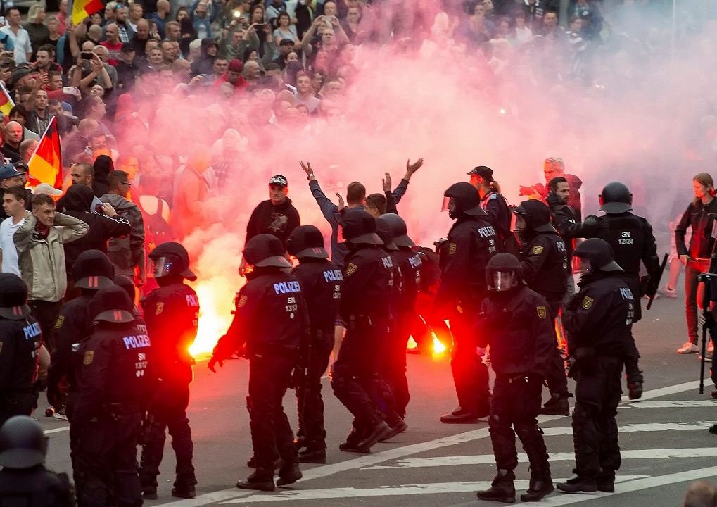August 27, 2018: Protesters light fireworks during a far-right demonstration in Chemnitz, Germany. August 27, 2018: Protesters light fireworks during a far-right demonstration in Chemnitz, Germany.
