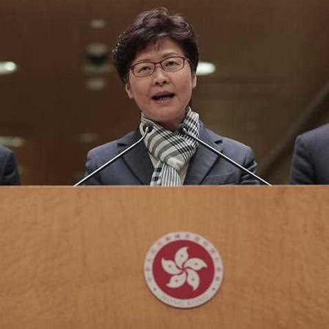 Hong Kong Chief Executive Carrie Lam, center, speaks during a press conference in Hong Kong, Monday, Nov. 11, 2019.