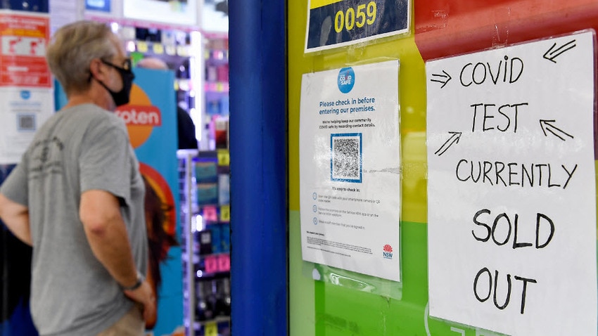 Signage notifying customers that Rapid Antigen Test kits are sold out is seen on the entrance to a chemist in Sydney, Tuesday, 11 January, 2022.