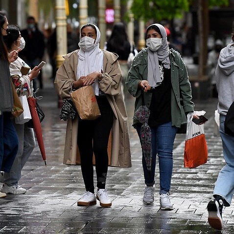 Shoppers wear face masks in Pitt St Mall, following 108 days of lockdown in Sydney.