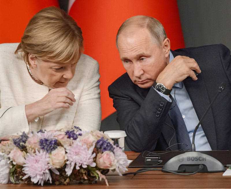 German Chancellor Angela Merkel and Russian President Vladimir Putin. The German leader speaks Russian and was raised in Communist East Russia.