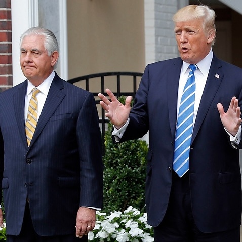 President Donald Trump with Secretary of State Rex Tillerson, left, speaks to members of the media following their meeting at Trump National Golf Club in August