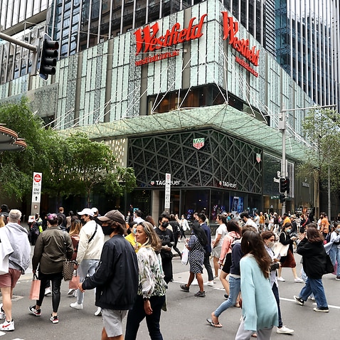 Shoppers walk around Pitt Street Mall in Sydney, Saturday, October 16, 2021