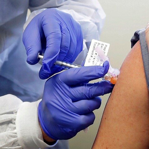 A patient receives a shot in the first-stage safety study of Moderna's potential vaccine (AAP)