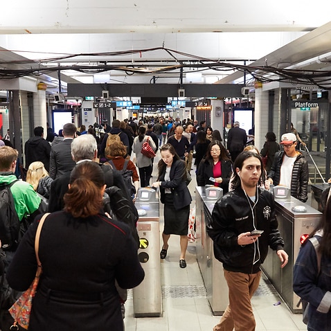 Commuters are seen in Town Hall station during peak hour in Sydney, Tuesday, August 7, 2018. Australia's population is expected to hit 25 million on Tuesday evening. (AAP Image/Erik Anderson) NO ARCHIVING