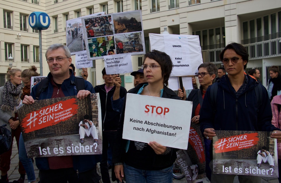 Demonstrators hold signs saying 'Stop - no deportations to Afghanistan', in Vienna this month.  