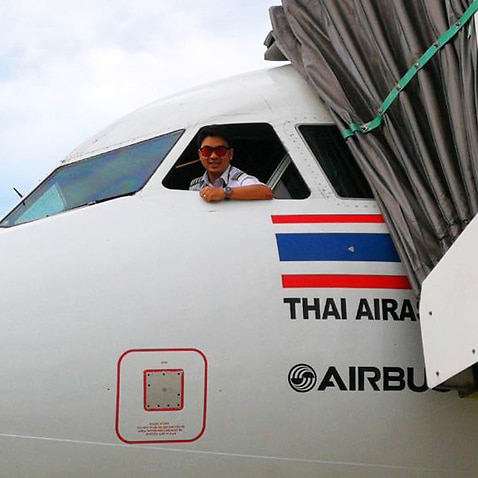 Image of Captain Karn Sri-ampai at the port side of an airbus aircraft