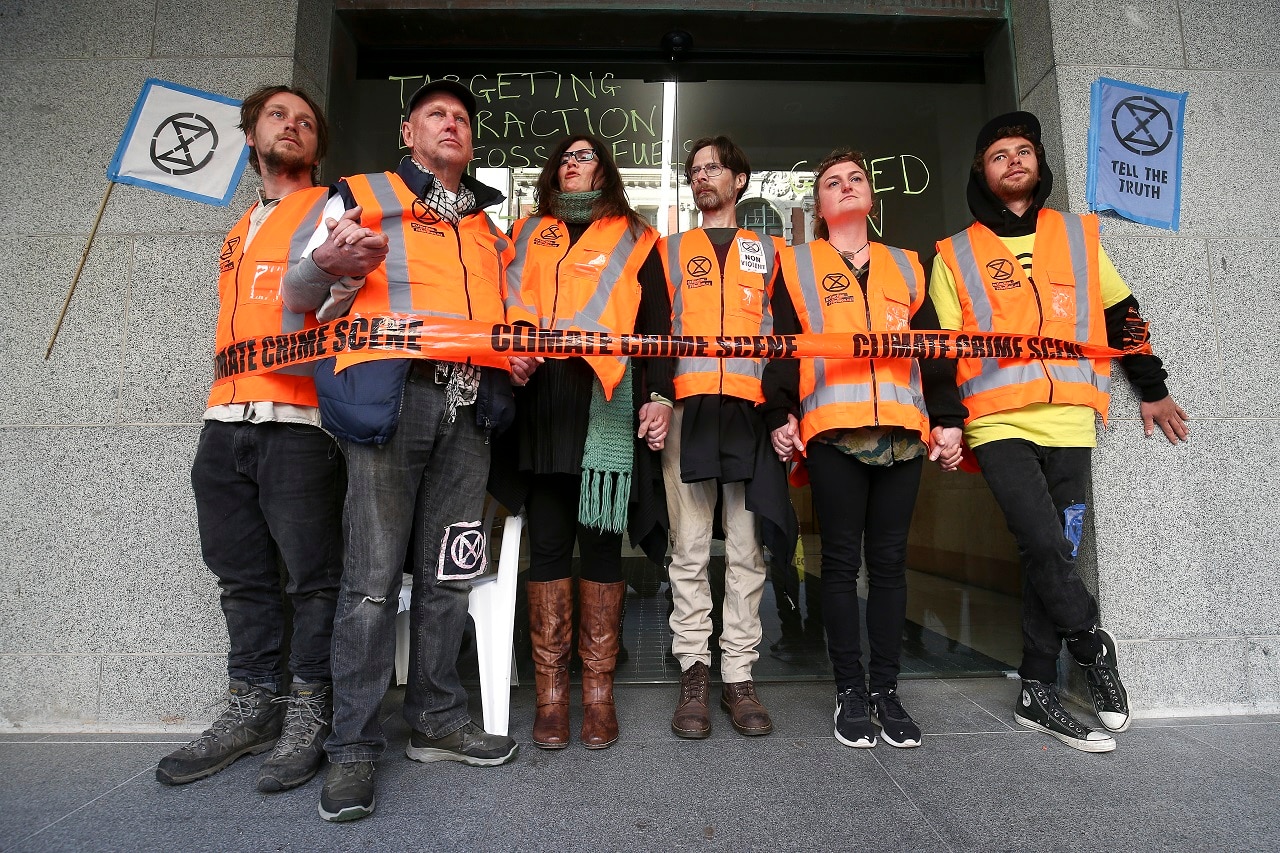 Protesters block the entrance to Ministry of Business, Innovation and Employment in Wellington.